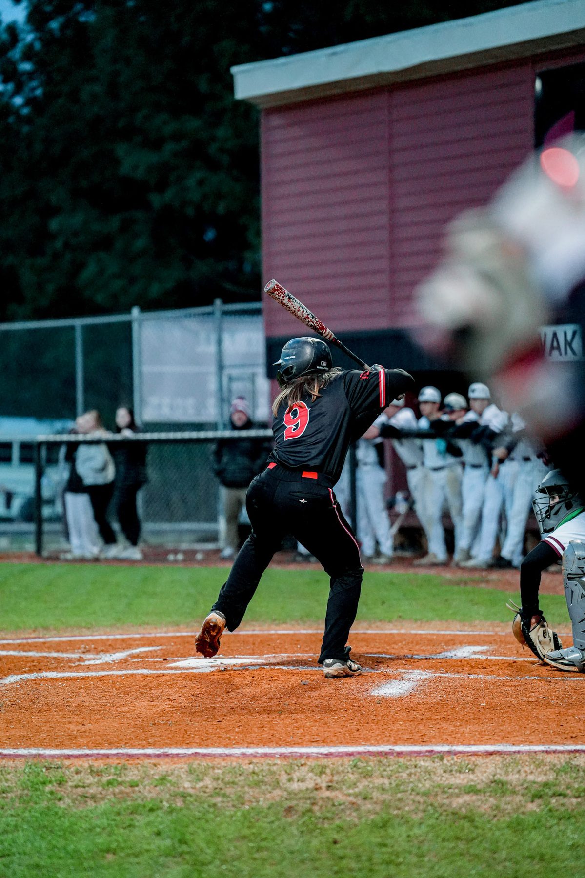 Zach finishing a swing during a baseball game